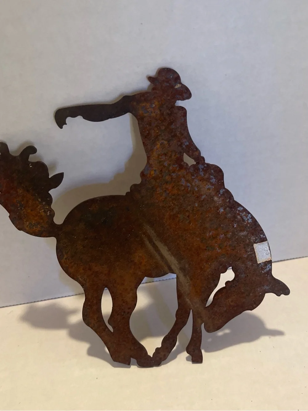 Vintage metal Rust Patina Cowboy Bucking Bronco